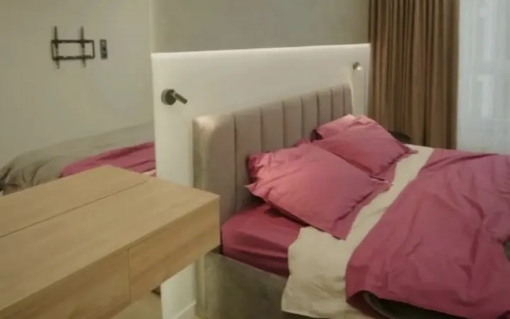 Freshly made bed in a rental suite