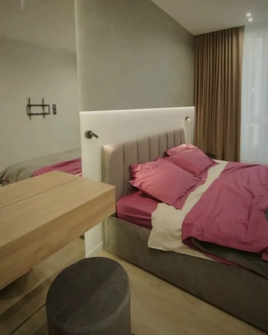 Freshly made bed in a rental suite
