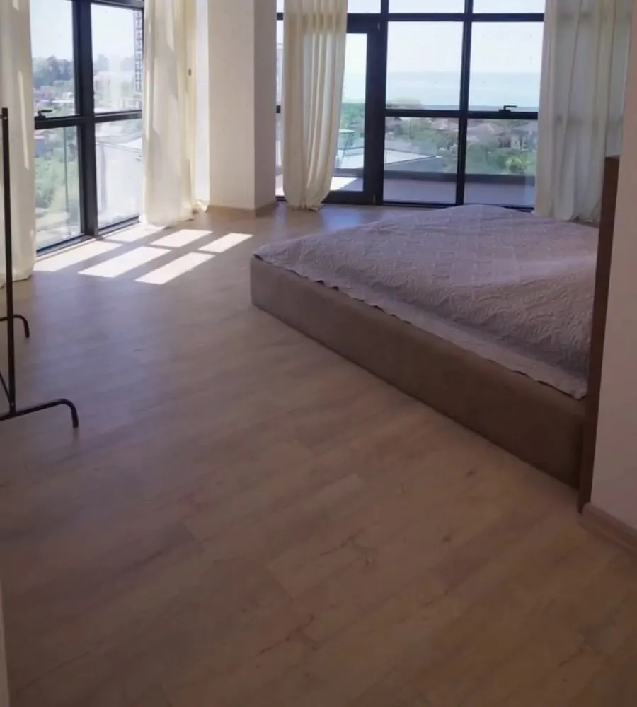 Empty apartment ready for move-in with floor-to-ceiling windows